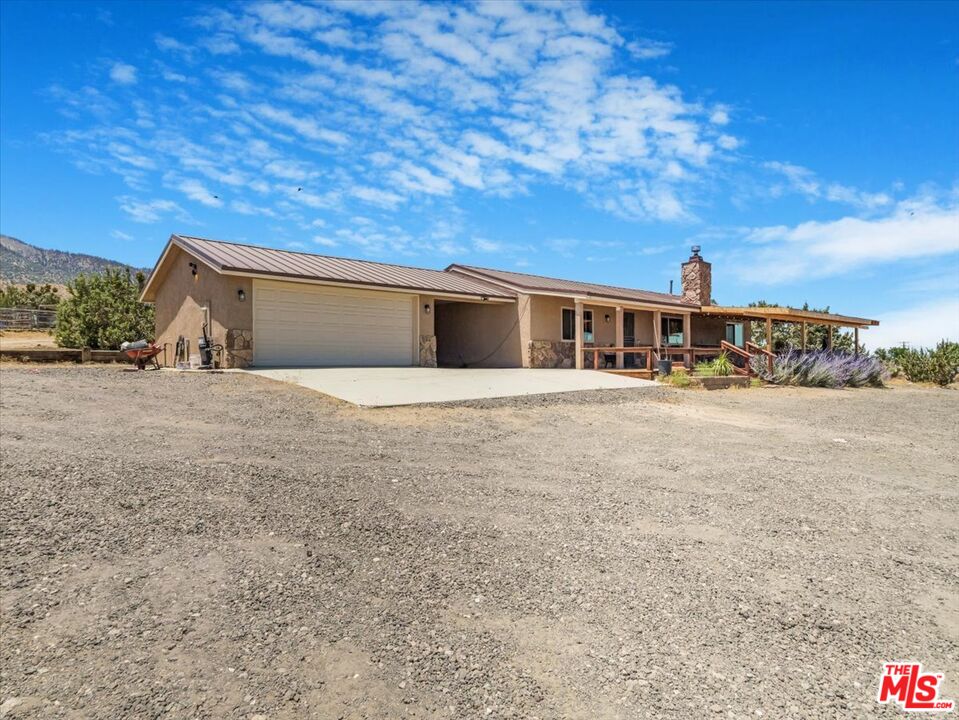 9446 Green Road Pinon Hills, CA 92372 - Photo 1 of 24 a view of a house with a backyard