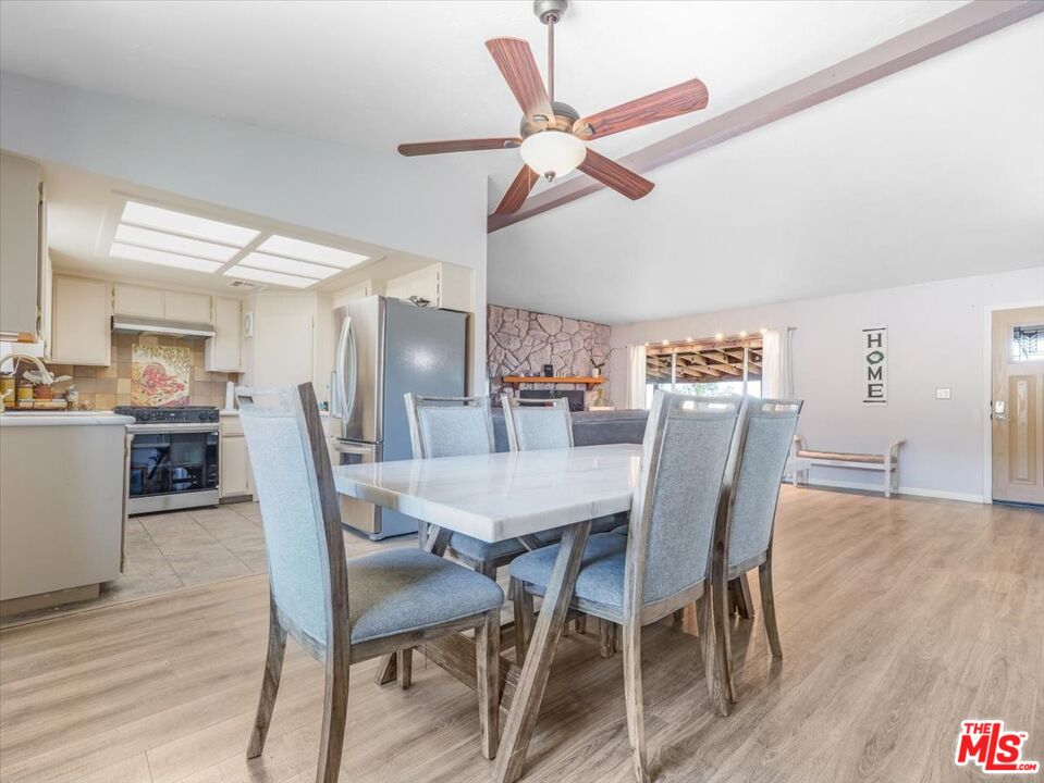 9446 Green Road Pinon Hills, CA 92372 - Photo 15 of 24 a view of a dining room with furniture and wooden floor