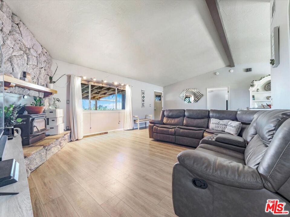 9446 Green Road Pinon Hills, CA 92372 - Photo 20 of 24 a living room with furniture and a large window