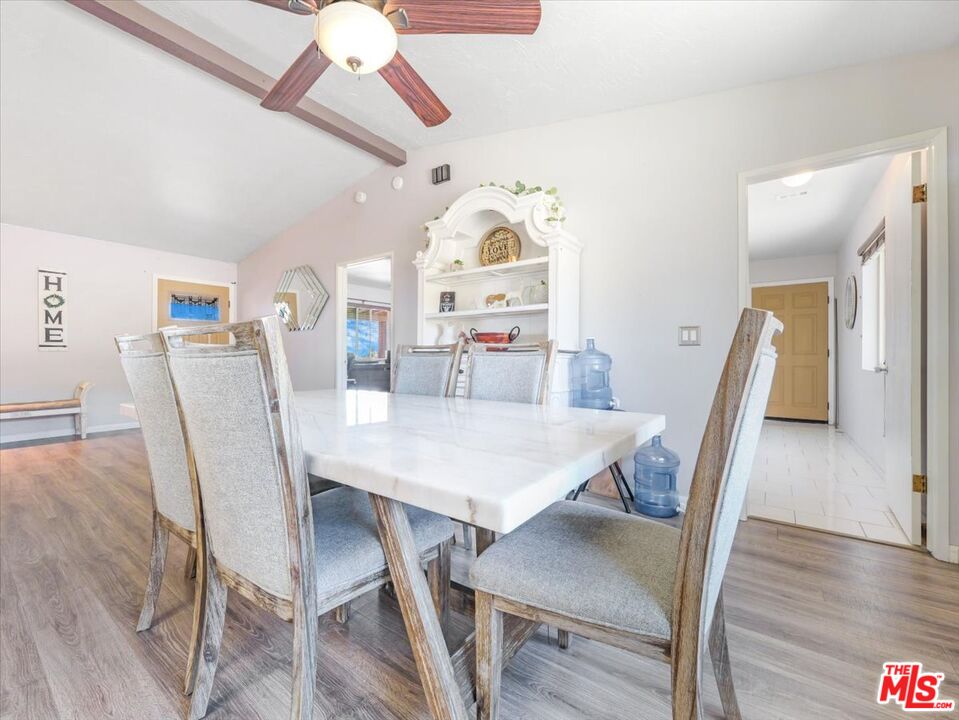 9446 Green Road Pinon Hills, CA 92372 - Photo 24 of 24 a view of a dining room with furniture and wooden floor