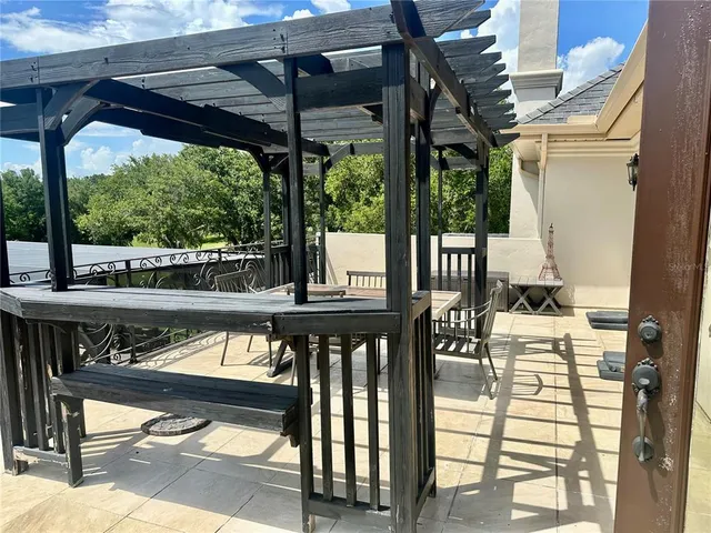 a bathroom with a granite countertop toilet sink and mirror