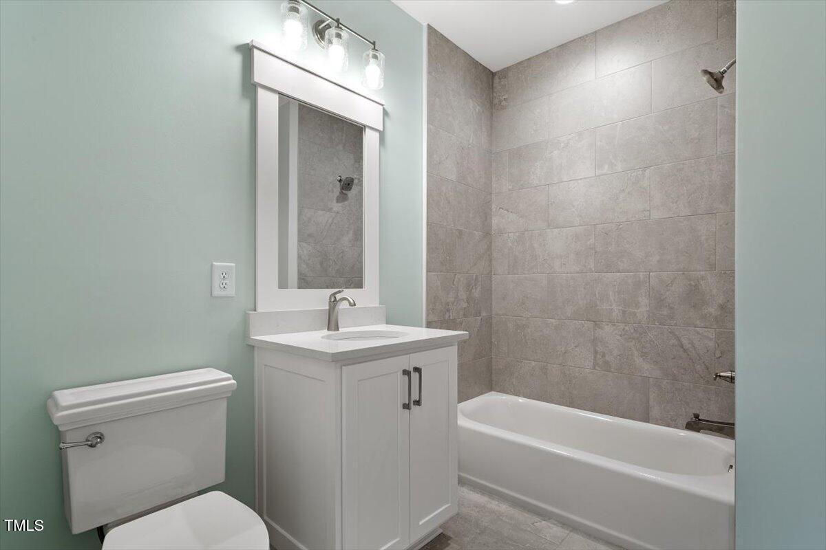 3934 Old Chapel Hill Road Durham, NC 27707 - Photo 42 of 47 a bathroom with a sink a toilet and shower