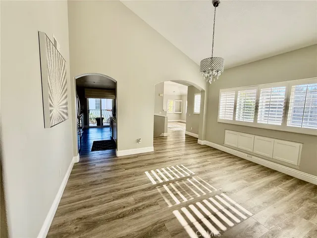 a view of a room with stairs and wooden floor