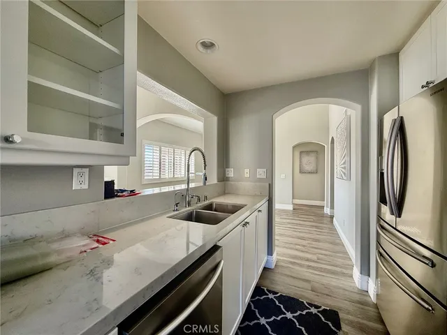 a kitchen with a sink and refrigerator