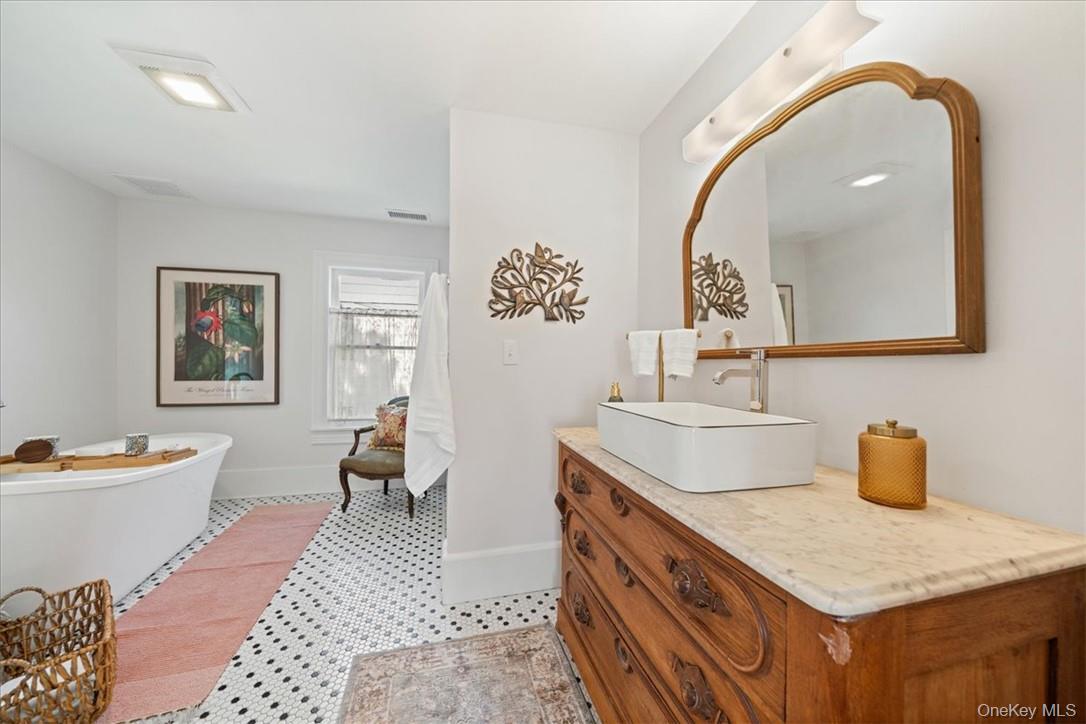 2585 River Road Damascus, PA 18415 - Photo 15 of 41 a room with a sink and a mirror