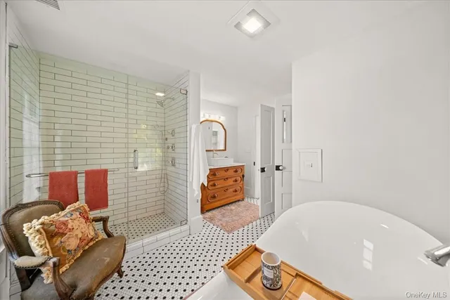 a bathroom with a bathtub and shower