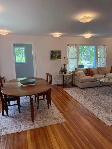 a living room with furniture and a table