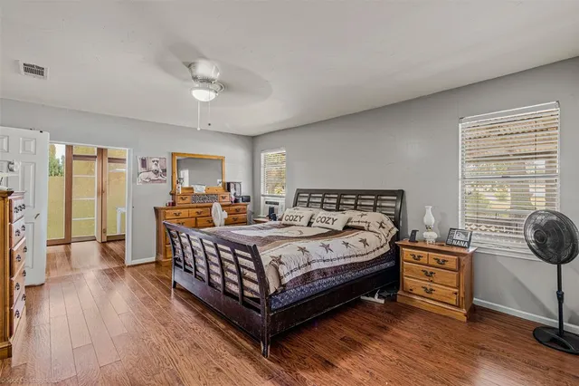 a bedroom with a bed and a dresser