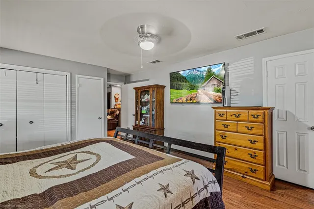 a bathroom with a sink a toilet and shower curtain