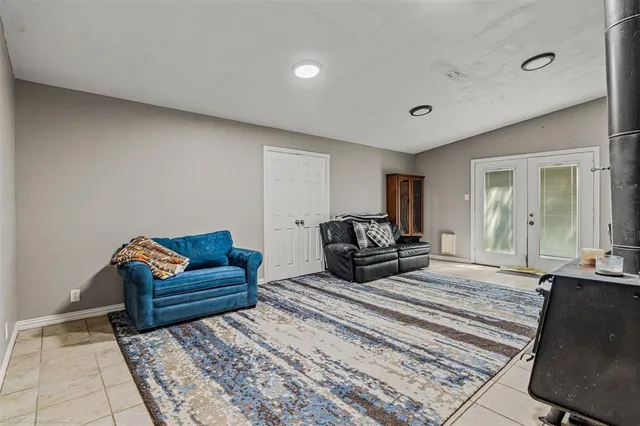 a bed room with a bed and a chair