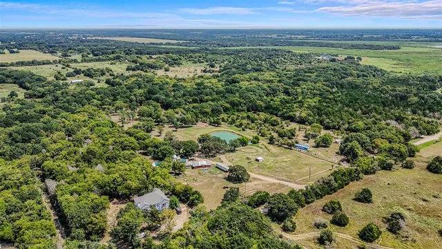 an aerial view of a houses with a lake view