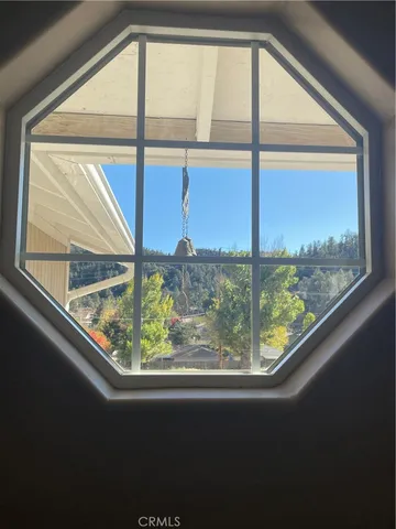 a living room with a fireplace and a flat screen tv
