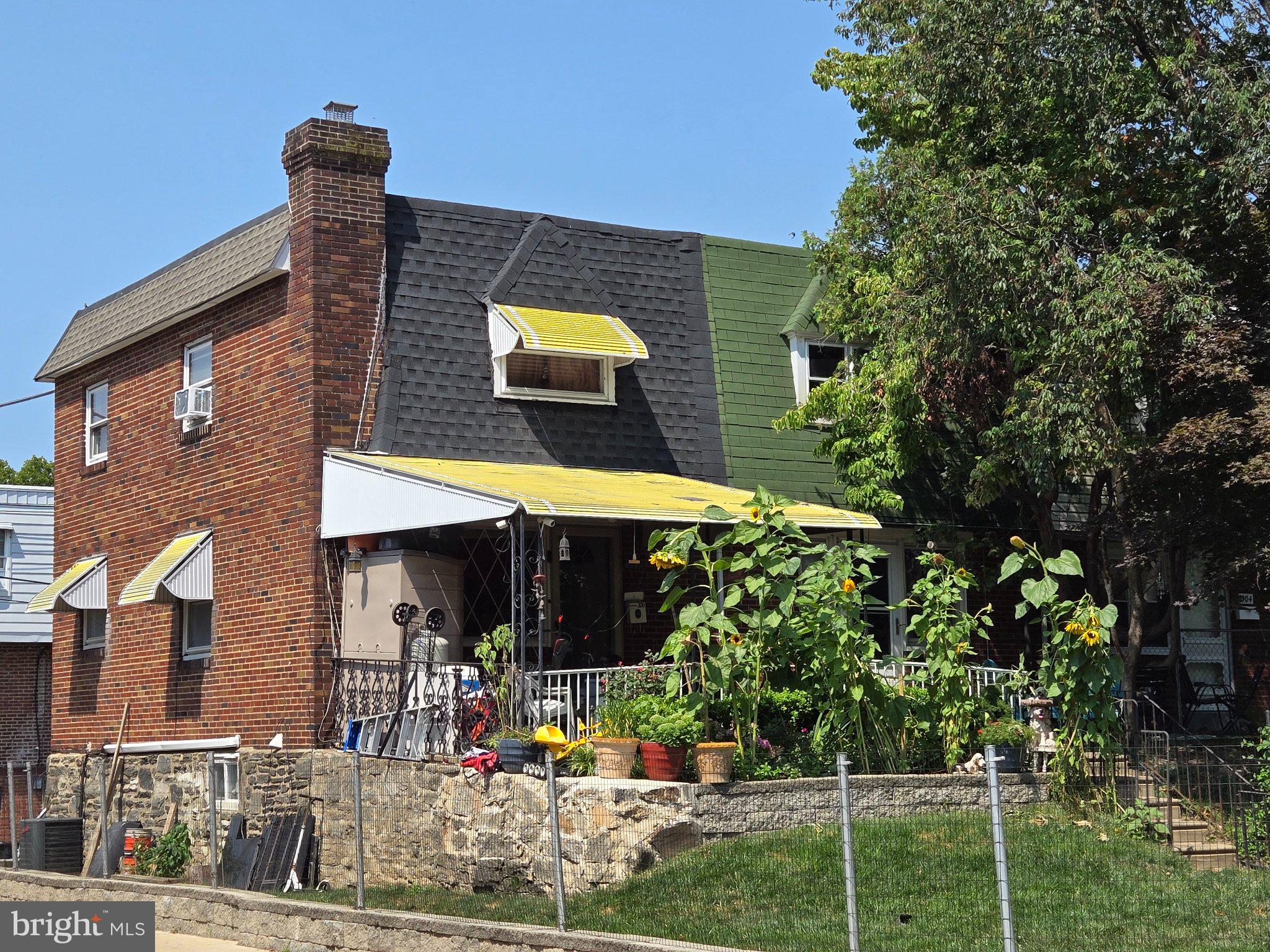 300 Springton Road Upper Darby, PA 19082 - Photo 18 of 19 Charming brick home with vibrant garden.