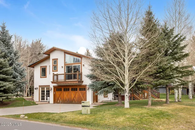 a front view of a building with a garden