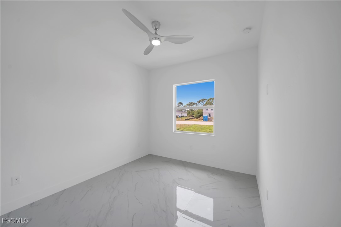 1155 Countess Avenue Lehigh Acres, FL 33974 - Photo 28 of 36 a view of an empty room and a window