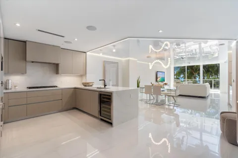a kitchen with stainless steel appliances a sink a stove and a refrigerator