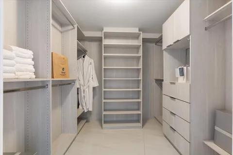 a view of a swimming pool with a yard and sitting space