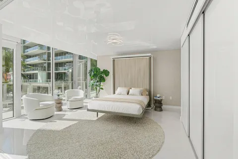 a lobby with furniture and a rug