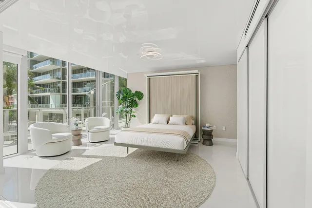 a lobby with furniture and a rug