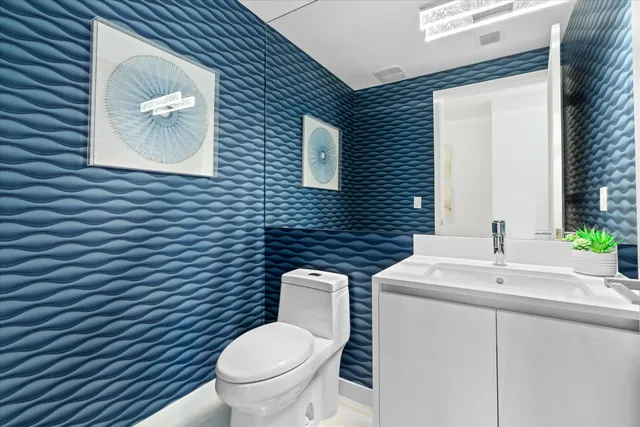 a living room with fireplace furniture and a large window