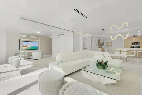 a room with a bed and a large window