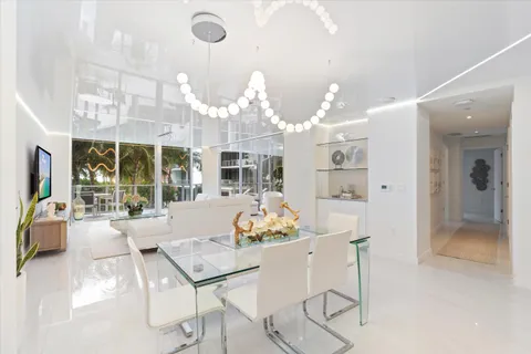 a kitchen with granite countertop a sink and white stainless steel appliances