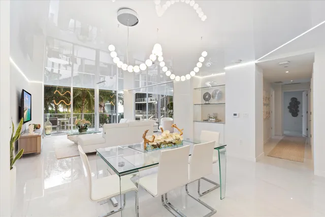 a kitchen with granite countertop a sink and white stainless steel appliances
