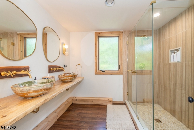 62 Mt Pleasant Road Columbia, NJ 07832 - Photo 15 of 46 a bathroom with a double vanity sink and a mirror