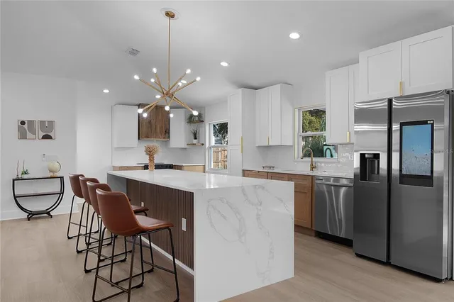 a kitchen with a stove and a white refrigerator