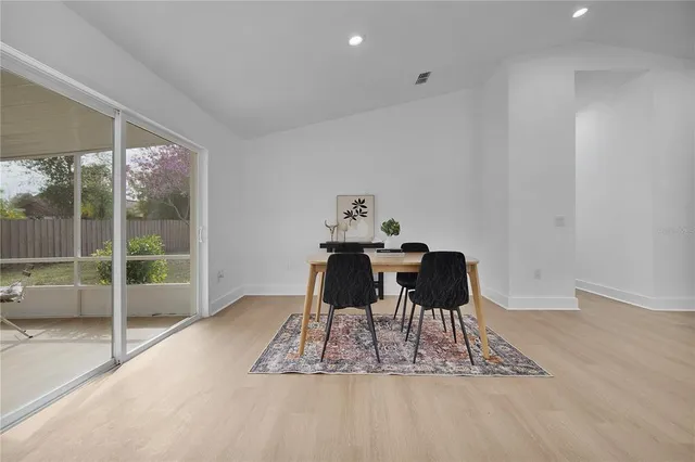a kitchen with a sink stainless steel appliances a counter space and cabinets