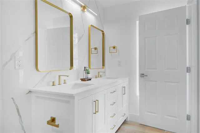 a bathroom with a sink and a mirror