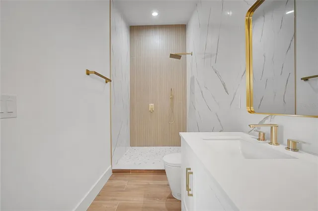 a bed room with a bed and a chandelier