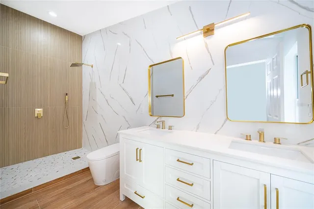 a bedroom with a bed and a potted plant