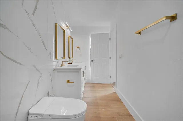 an empty room with a ceiling fan and carpet