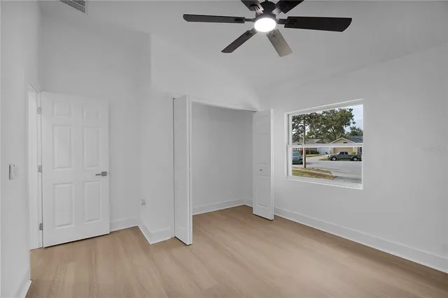 a view of a swimming pool with a yard