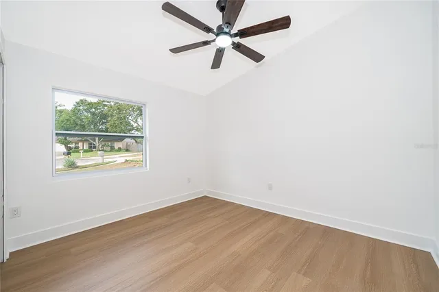 a swimming pool with outdoor seating and yard