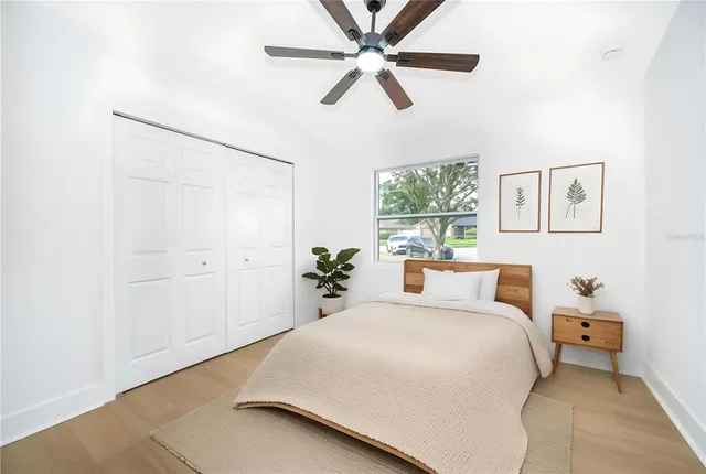 a view of backyard of house with green space