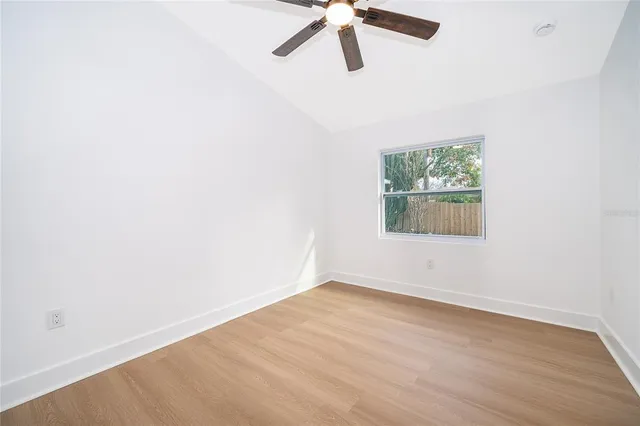 a view of a swimming pool with a yard