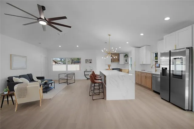 a dining room with furniture and wooden floor