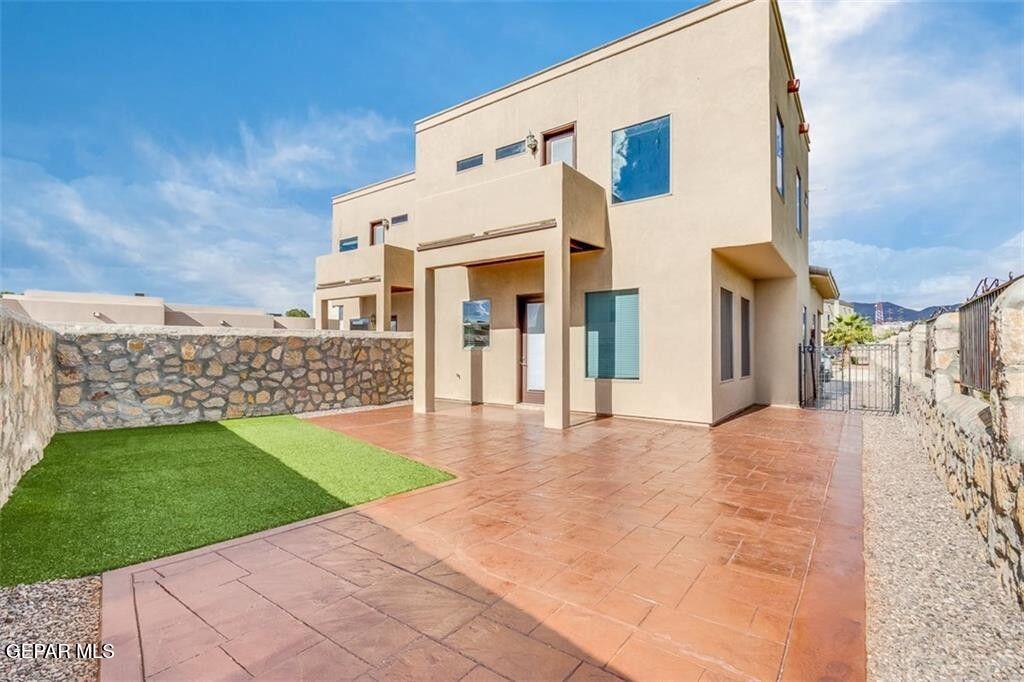401 Ana Way, Unit B El Paso, TX 79912 - Photo 15 of 28 a front view of a house with a yard and garage