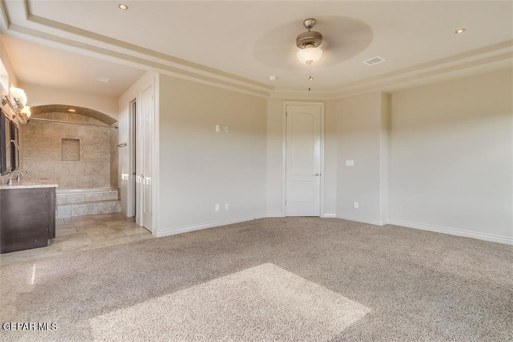 401 Ana Way, Unit B El Paso, TX 79912 - Photo 20 of 28 a view of a big room with windows and cabinet