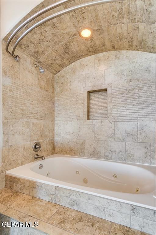 401 Ana Way, Unit B El Paso, TX 79912 - Photo 23 of 28 a bathroom with a bathtub and shower