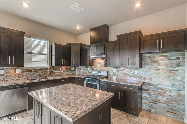 a view of a kitchen with a sink