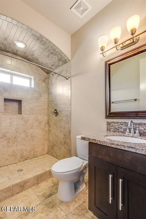 401 Ana Way, Unit B El Paso, TX 79912 - Photo 7 of 28 a bathroom with a sink a toilet and shower