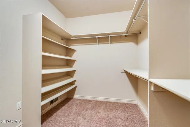 a view of an empty walk in closet