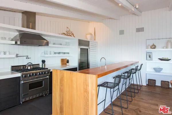 a kitchen with a sink and a refrigerator