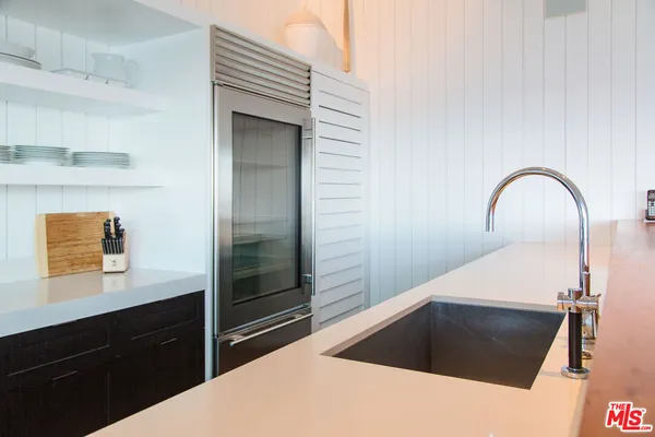 a kitchen with stove and cabinets