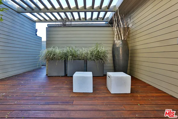 a view of backyard with sitting area