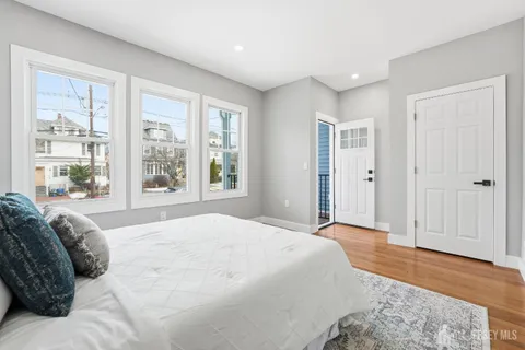 a spacious bedroom with a large bed and a window