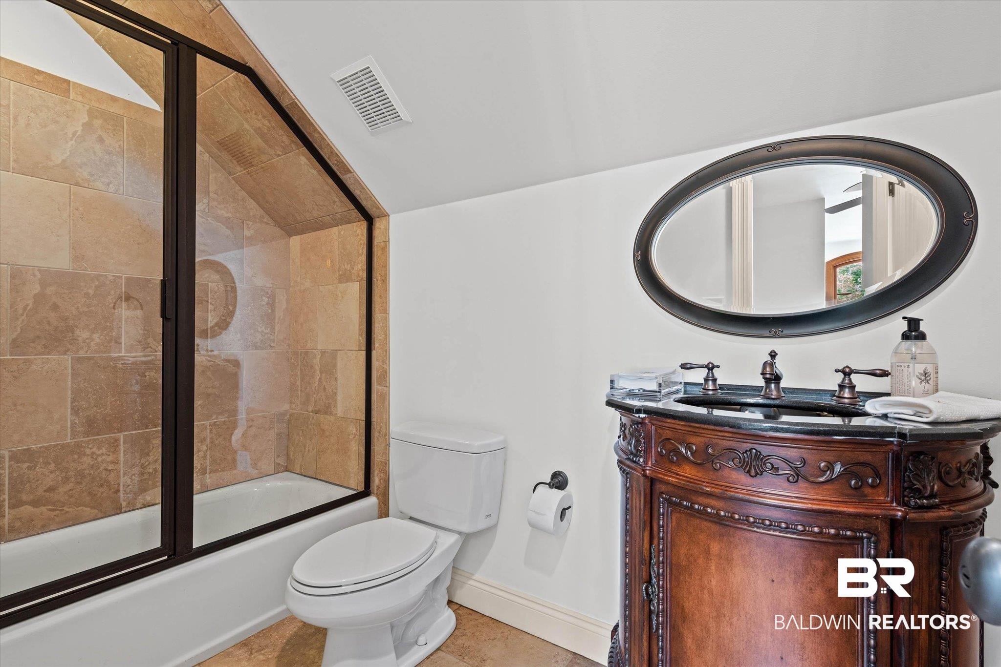 3459 Rue Royal Mobile, AL 36693 - Photo 27 of 31 Alcove bathtub with stone tile surround and glass enclosure